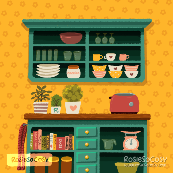 An illustration of a tiny kitchen or kitchenette. The counters and cabinets are teal coloured, and the counter top is a warm medium wood colour. All the counters and cabinets are open and have shelving. But the counters also have a few tiny drawers in the middle. On the shelves are items like glasses, mugs, plates, measuring cup, scale, cook books in English and Japanese and a cookie jar. On the left is a red kitchen towel, hanging from the side. On the counter top there’s a red toaster and three plants.