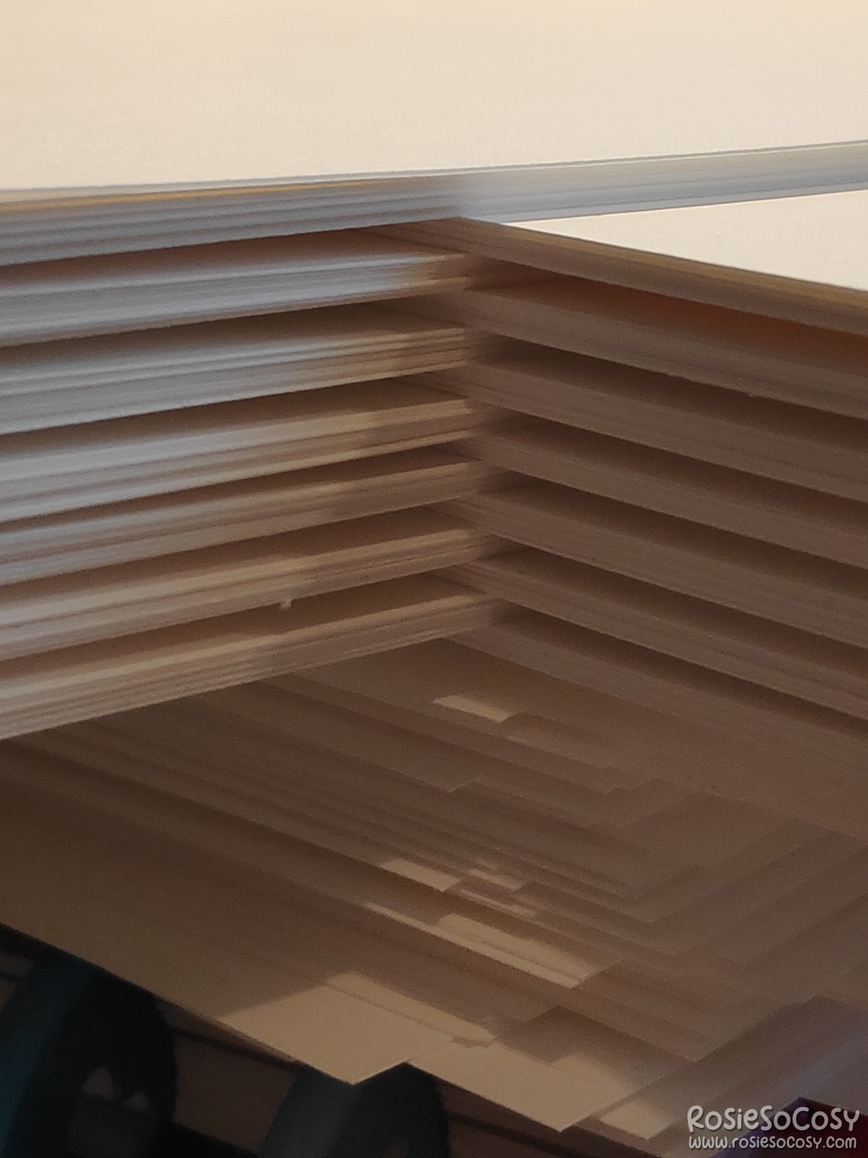 Planner inserts 2023; 14 stacks of 10 sheets of 160 grams creamy white paper, waiting to be printed.