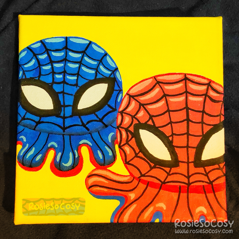 A canvas painting done in Posca markers, with two reversible octopus plushies on it. These are inspired by Spiderman. One is dark blue, the other is red. Both have a Spiderweb pattern all over.