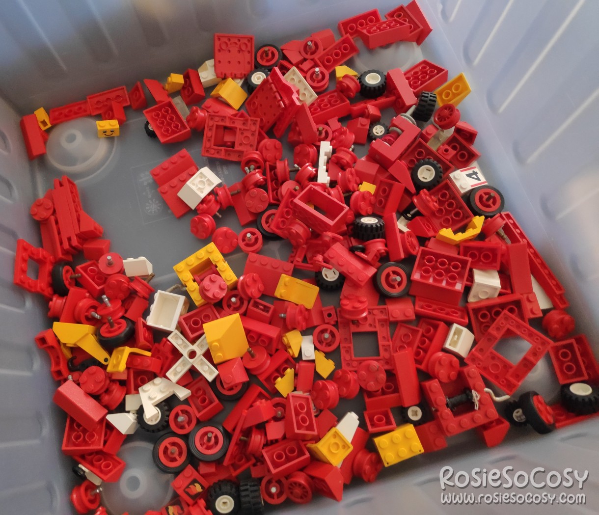 New batch of old LEGO bricks and parts. Mostly red bricks, some yellow, some wheels.